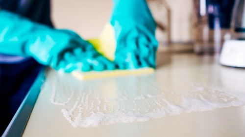 Charity workers receiving donated rugs and runners